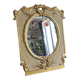 Napoleon III mirror in carved gilded wood, oval mercury glass.