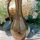 Carafe vase in chiseled brass