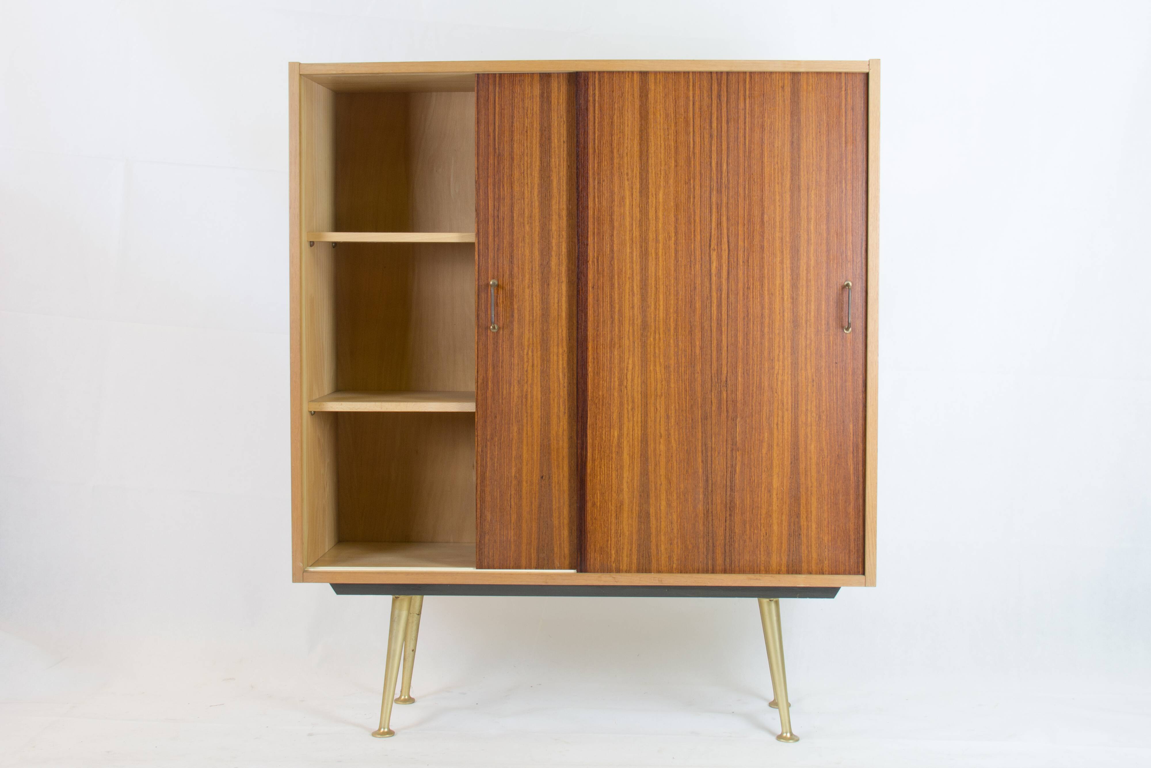 Wardrobe with sliding doors by Deutsche Werkstätten München