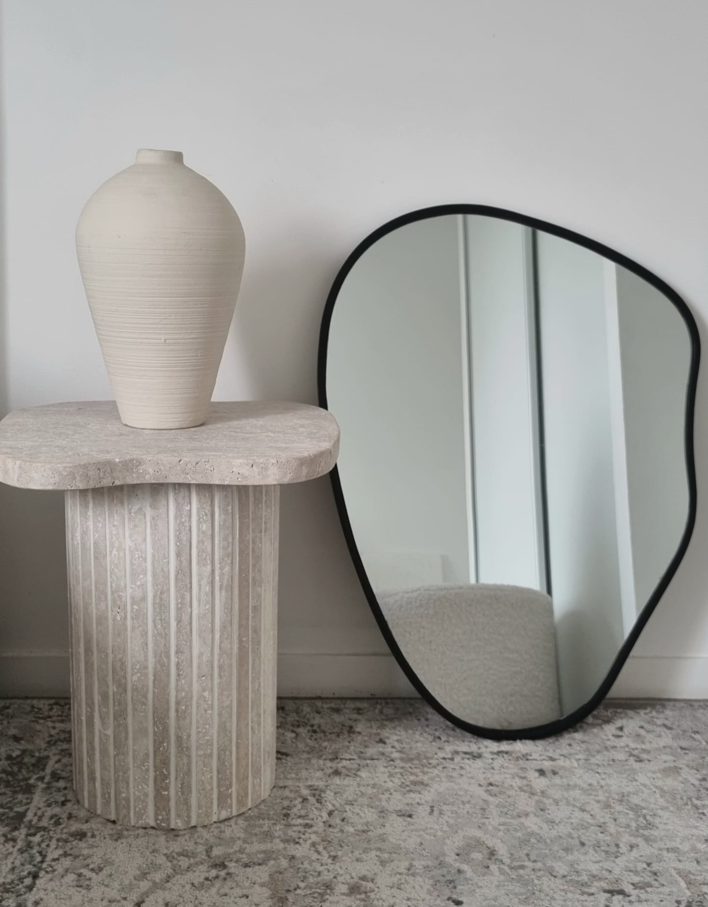 Alpha irregular side table in natural travertine - ribbed foot