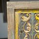 Rectangular Indonesian construction element with blue and yellow plant in carved wood