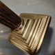 Golden brass candlestick, Corinthian style, vintage