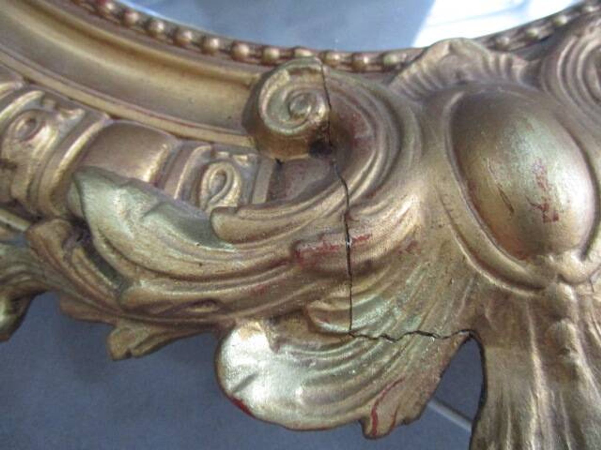 Antique mirror in wood and gilded stucco