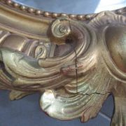 Antique mirror in wood and gilded stucco