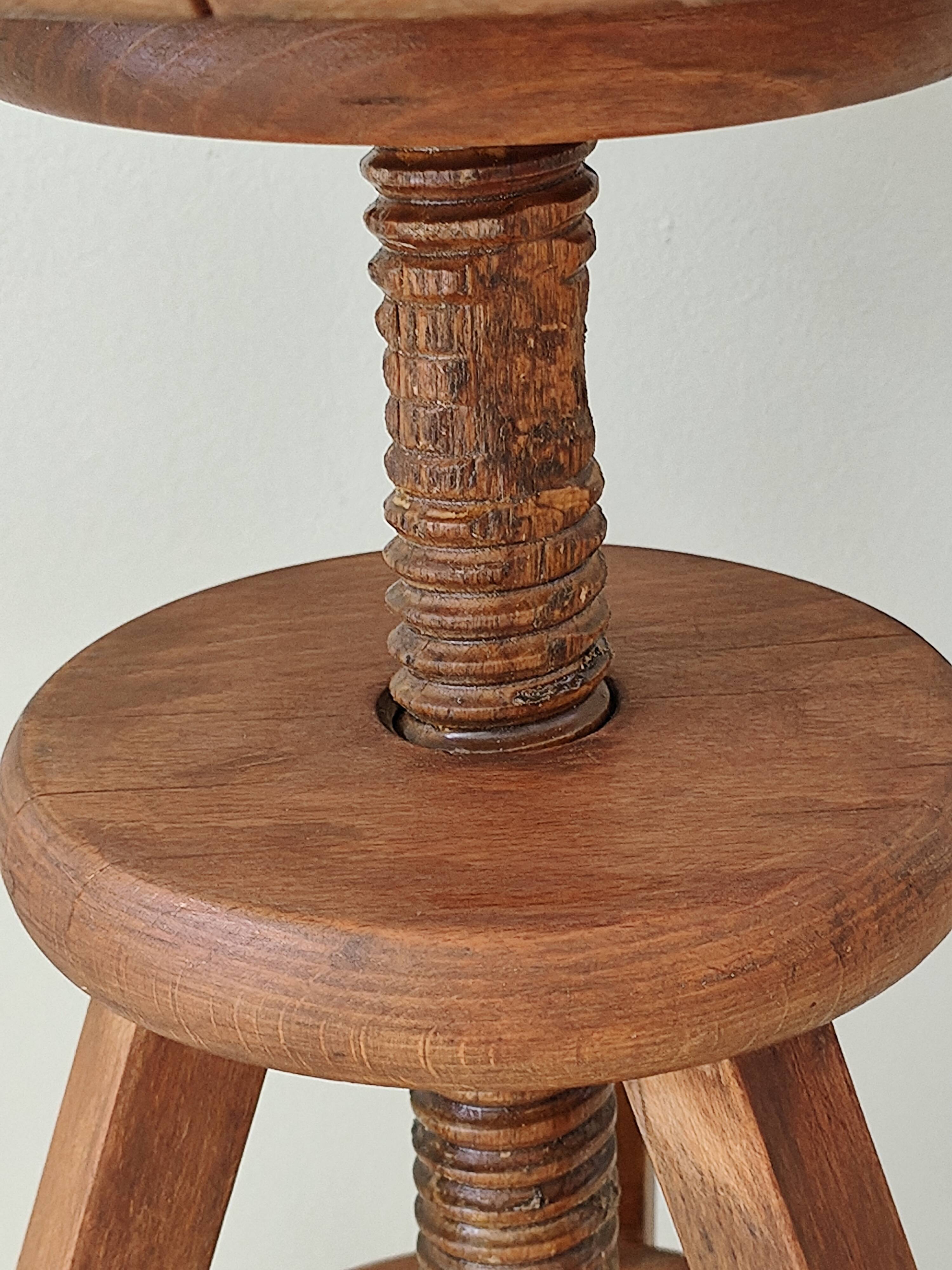 Adjustable vintage workshop stool made of solid wood