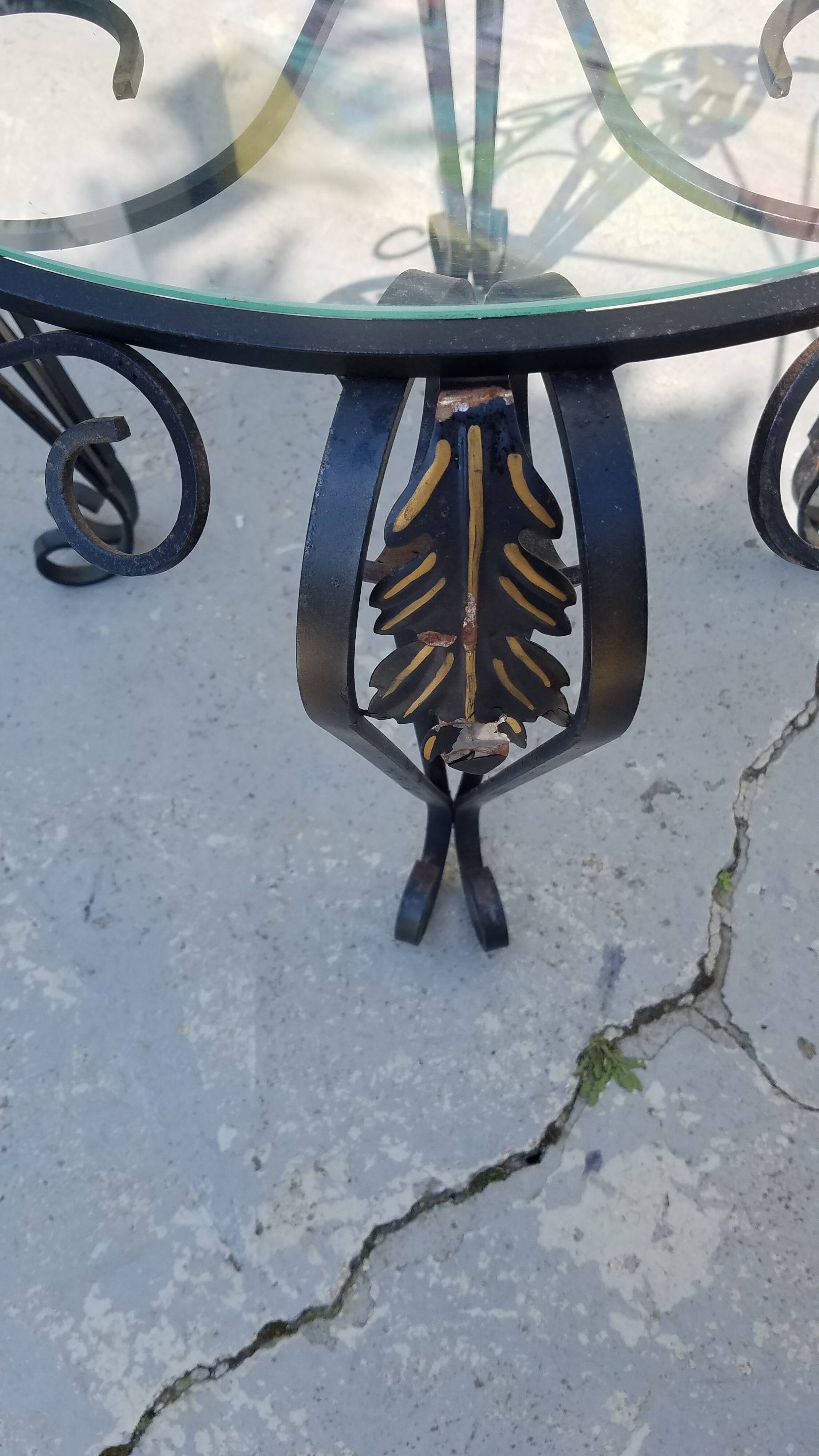 Wrought iron and glass round table