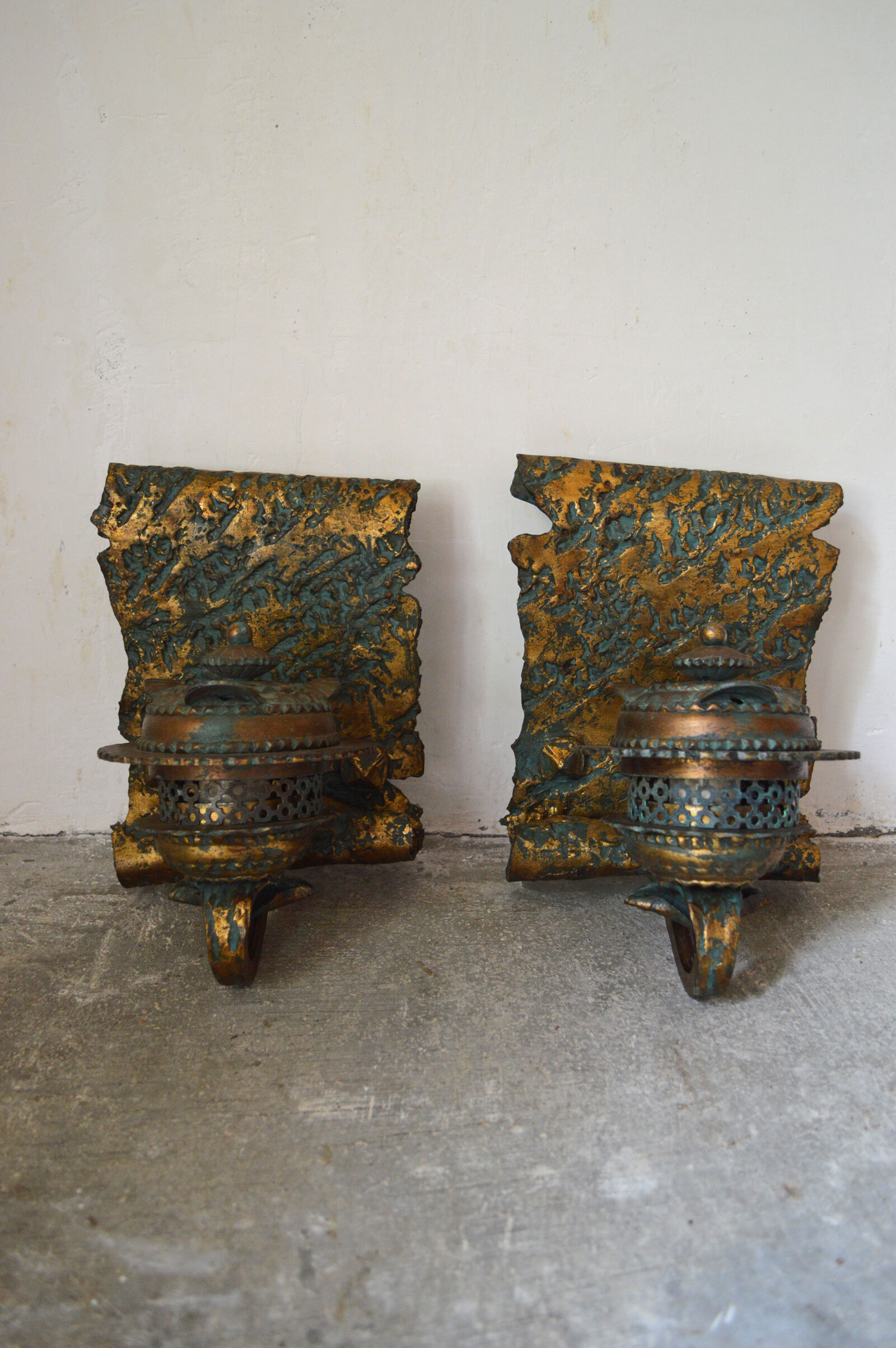 Pair of patinated wrought iron sconces