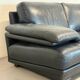 Two-seater Natuzzi sofa in navy blue leather.
