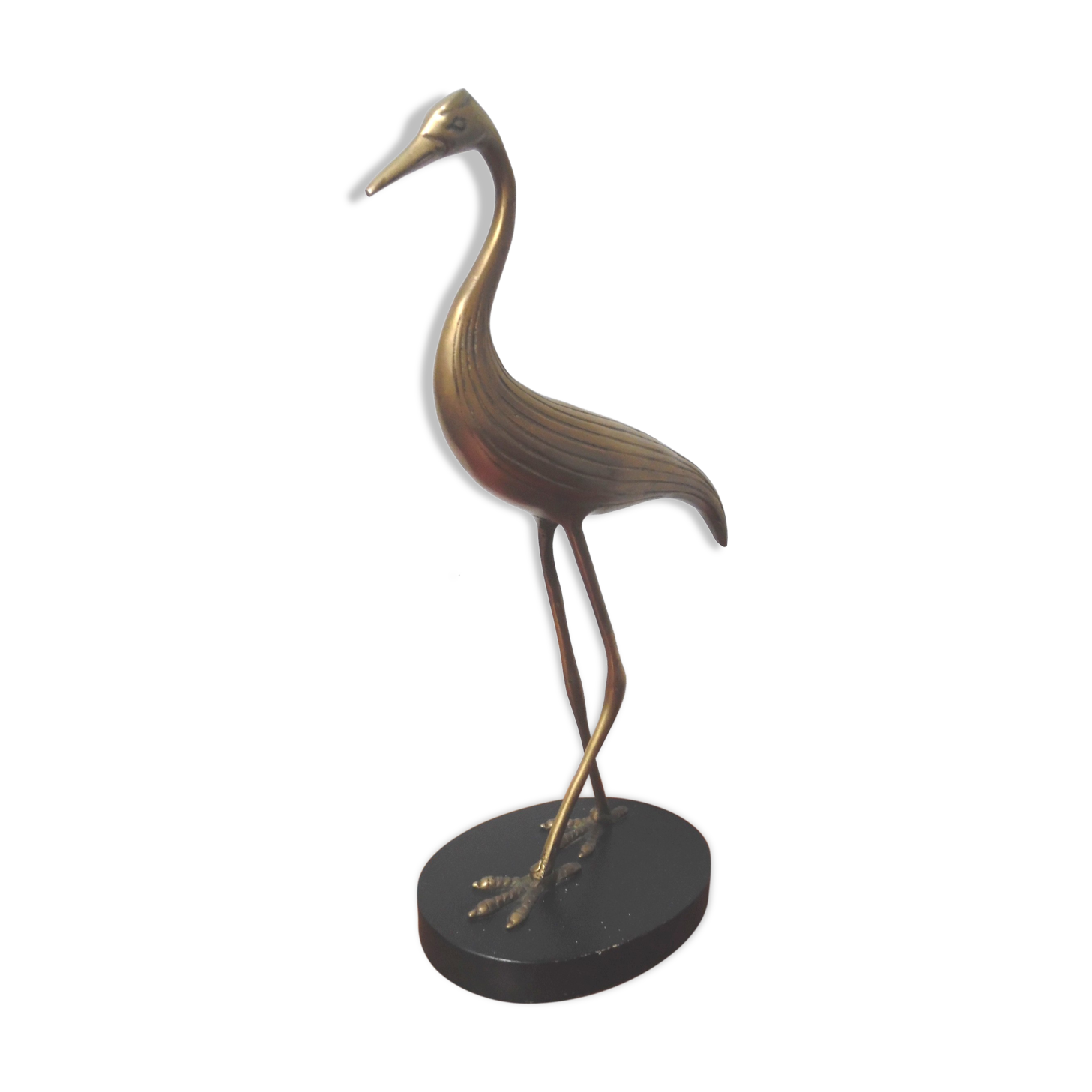 Brass heron standing
