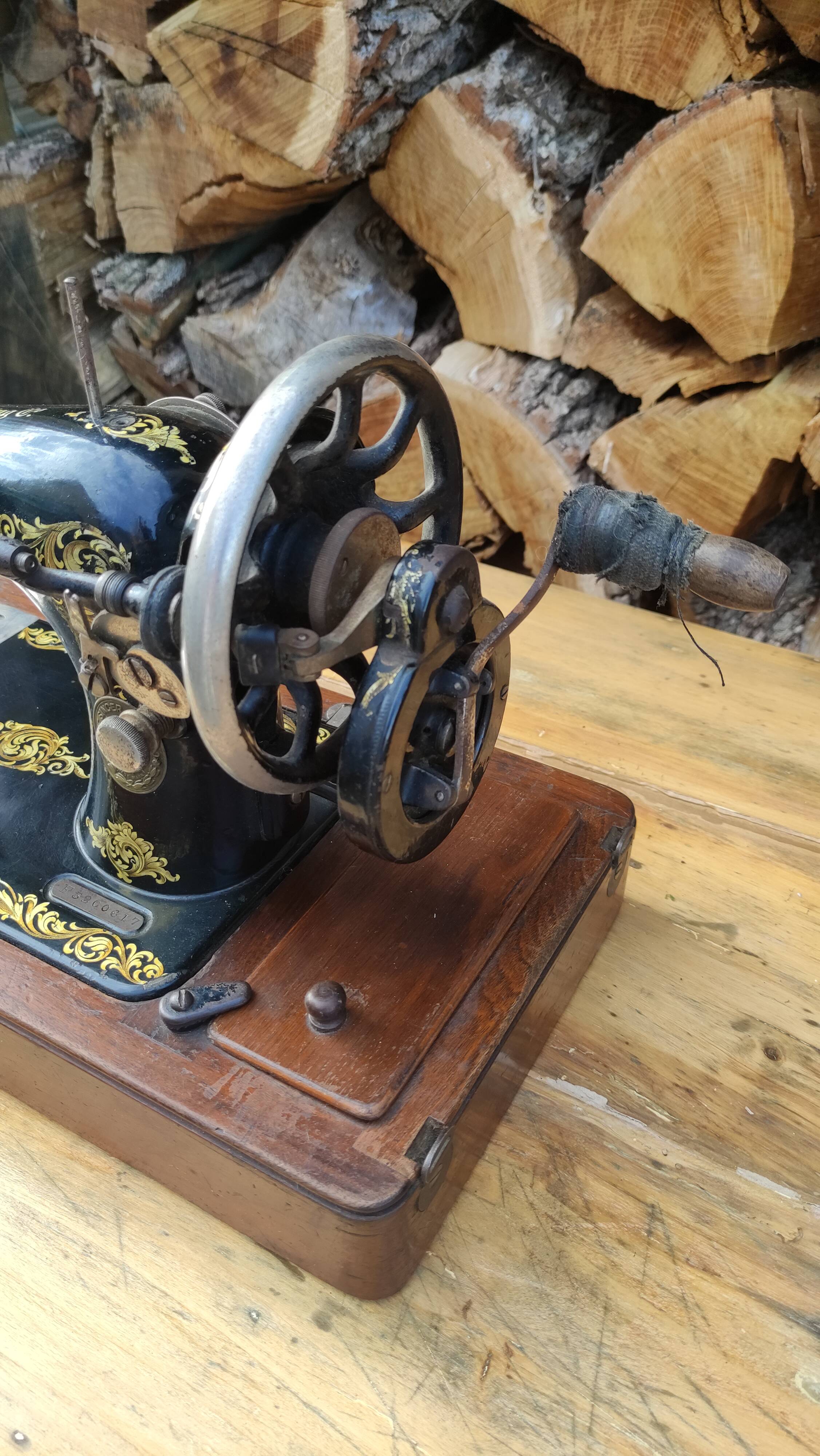 Old Singer sewing machine on its original base