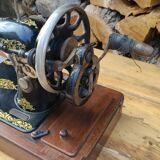 Old Singer sewing machine on its original base