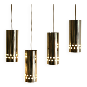 Four gilded metal pendant lights. France 80s