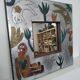 Curious riveted metal mirror 40x40cm