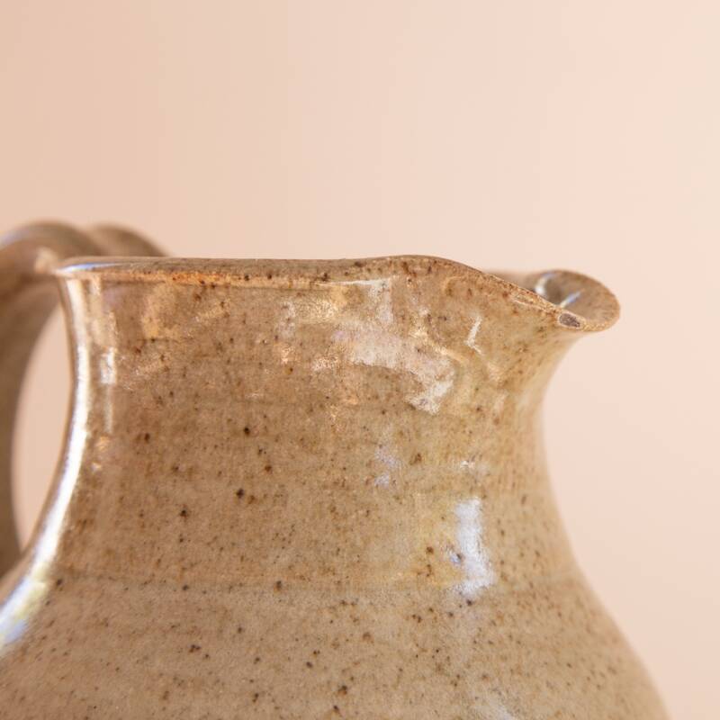 Stoneware carafe signed CA on handle