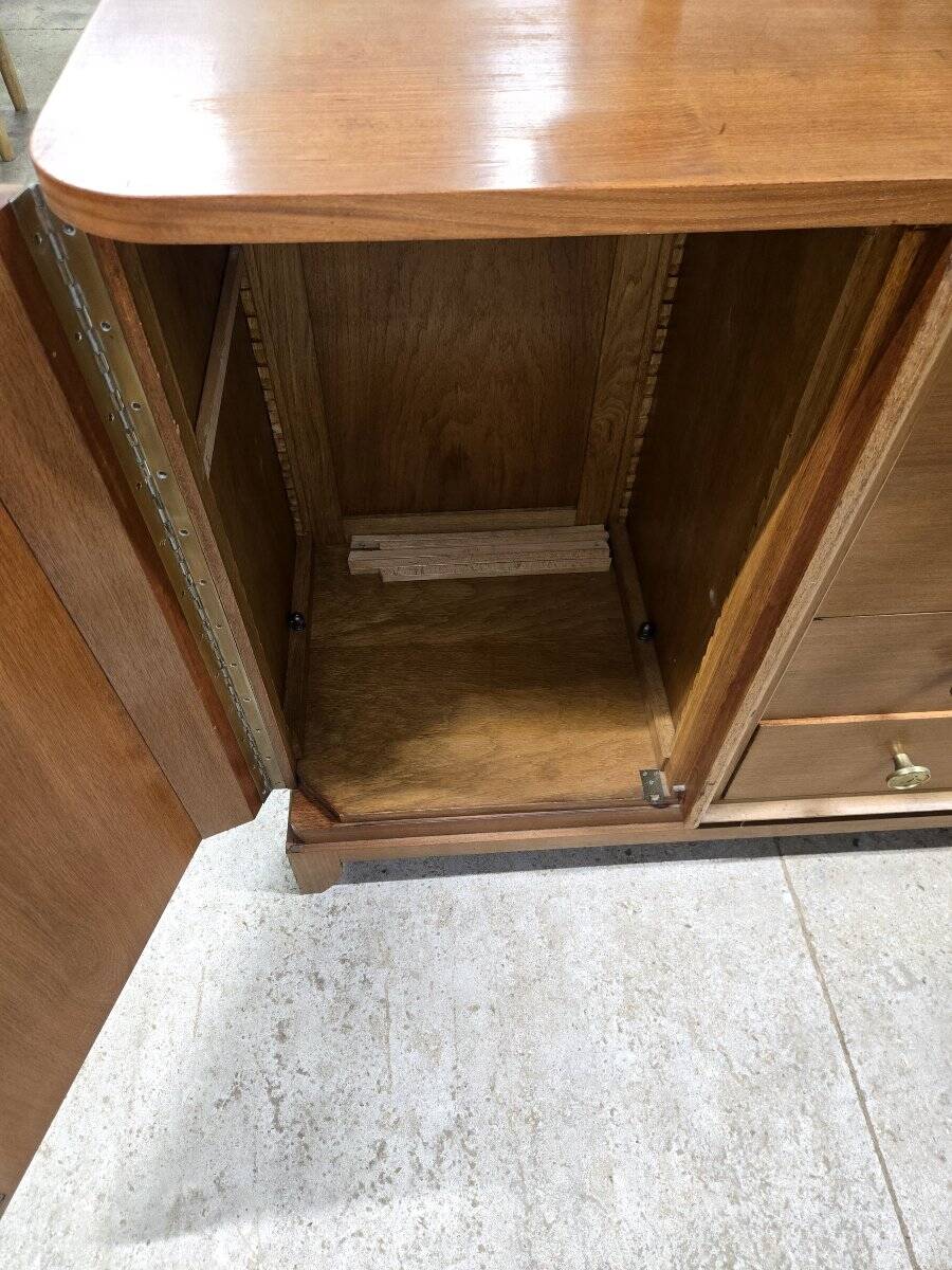 According to André Arbus, a sideboard in a row from the Art Deco period in blonde mahogany.