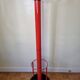 Coat rack in orange lacquered metal published by Seccose, 80s