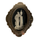 Miniature on ivory, oval brass frame.