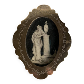 Miniature on ivory, oval brass frame.