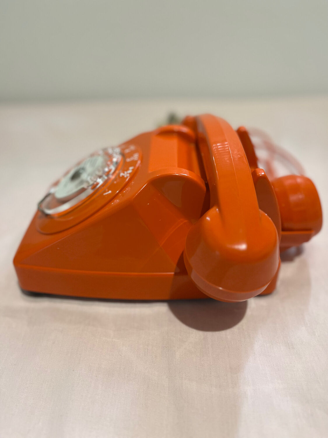 Orange vintage phone with socotel dial