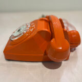 Orange vintage phone with socotel dial