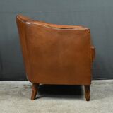 Solange club armchair in sheepskin leather.