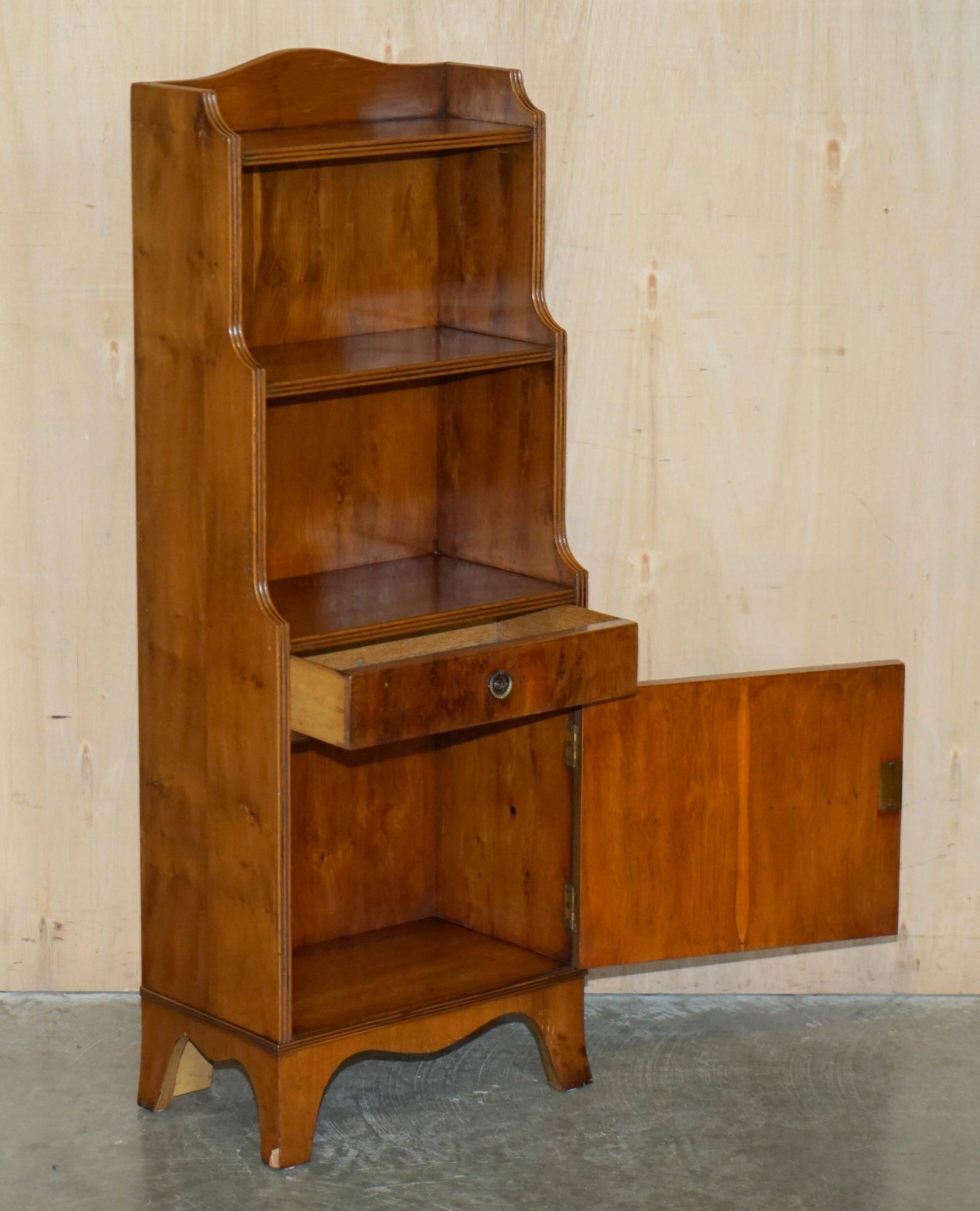 Pair of vintage English hardwood bookcases in a cascade style with cupboards.