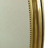 Miroir ovale classique doré à décor de ruban, France