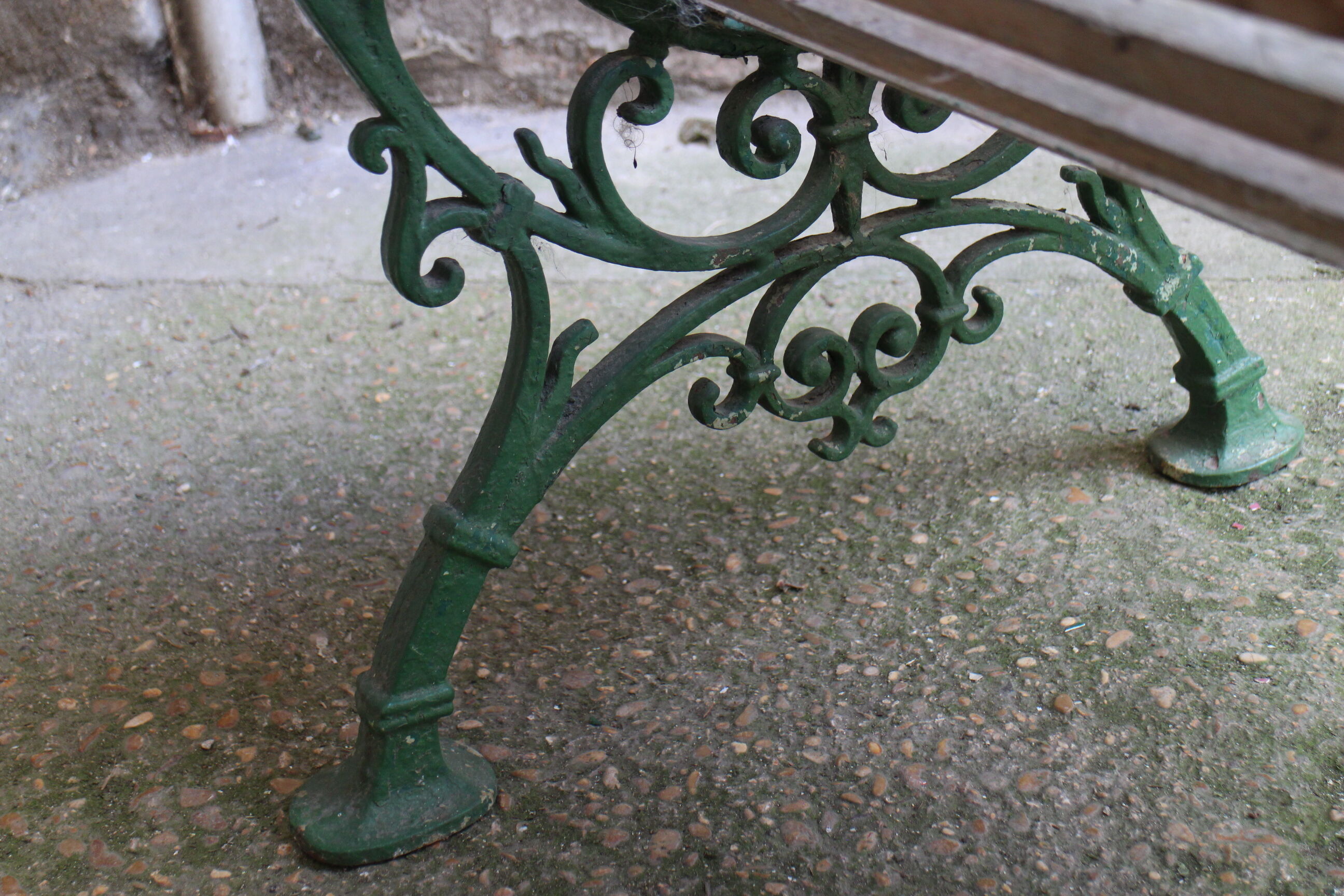 Old bench cast iron base and wooden slats