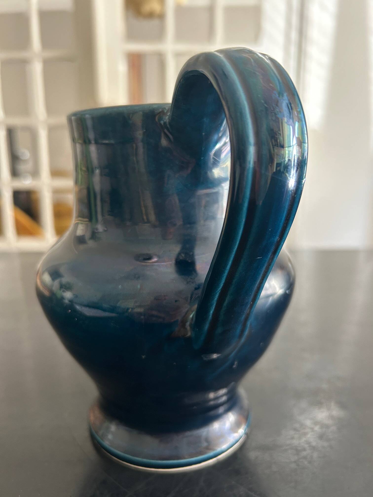 blue pitcher the potter chin