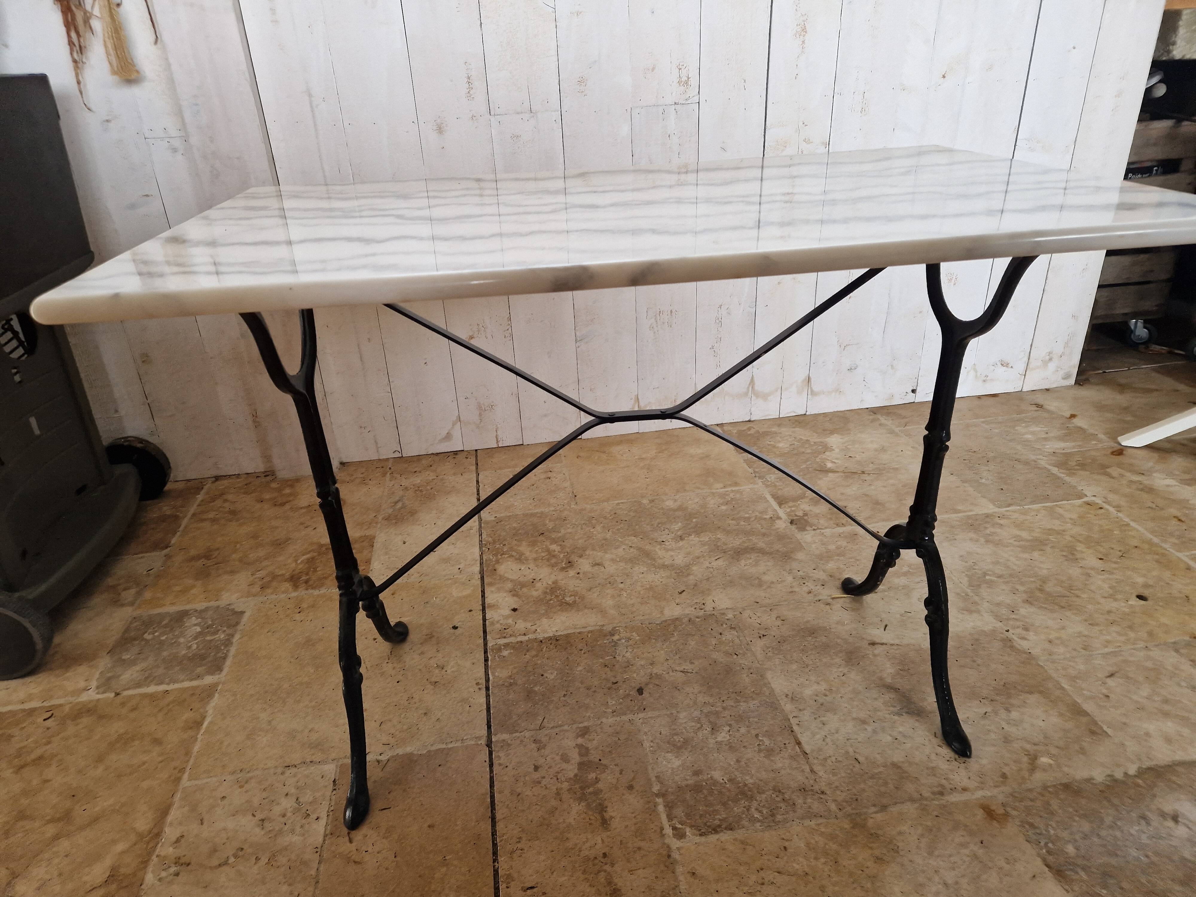 Bistro table with marble top and cast iron legs