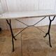 Bistro table with marble top and cast iron legs