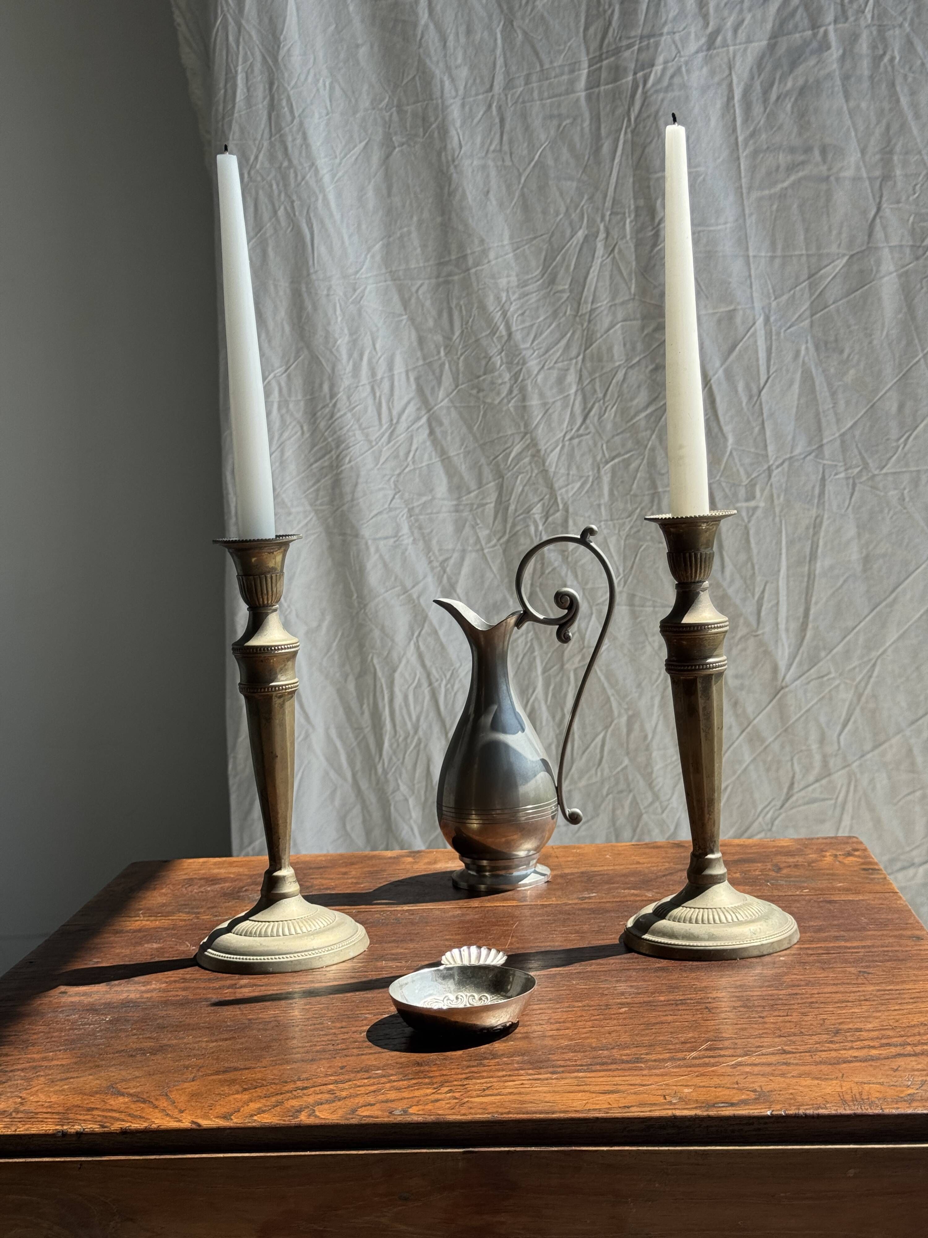 Pair of classic candlesticks in patinated gold metal H25