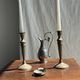 Pair of classic candlesticks in patinated gold metal H25