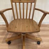 Solid wood swivel and reclining armchair.