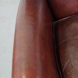 Sheepskin armchair correctly finished with decorative nails and in good condition