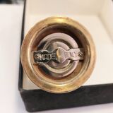 Varnished wood and brushed brass pepper mill