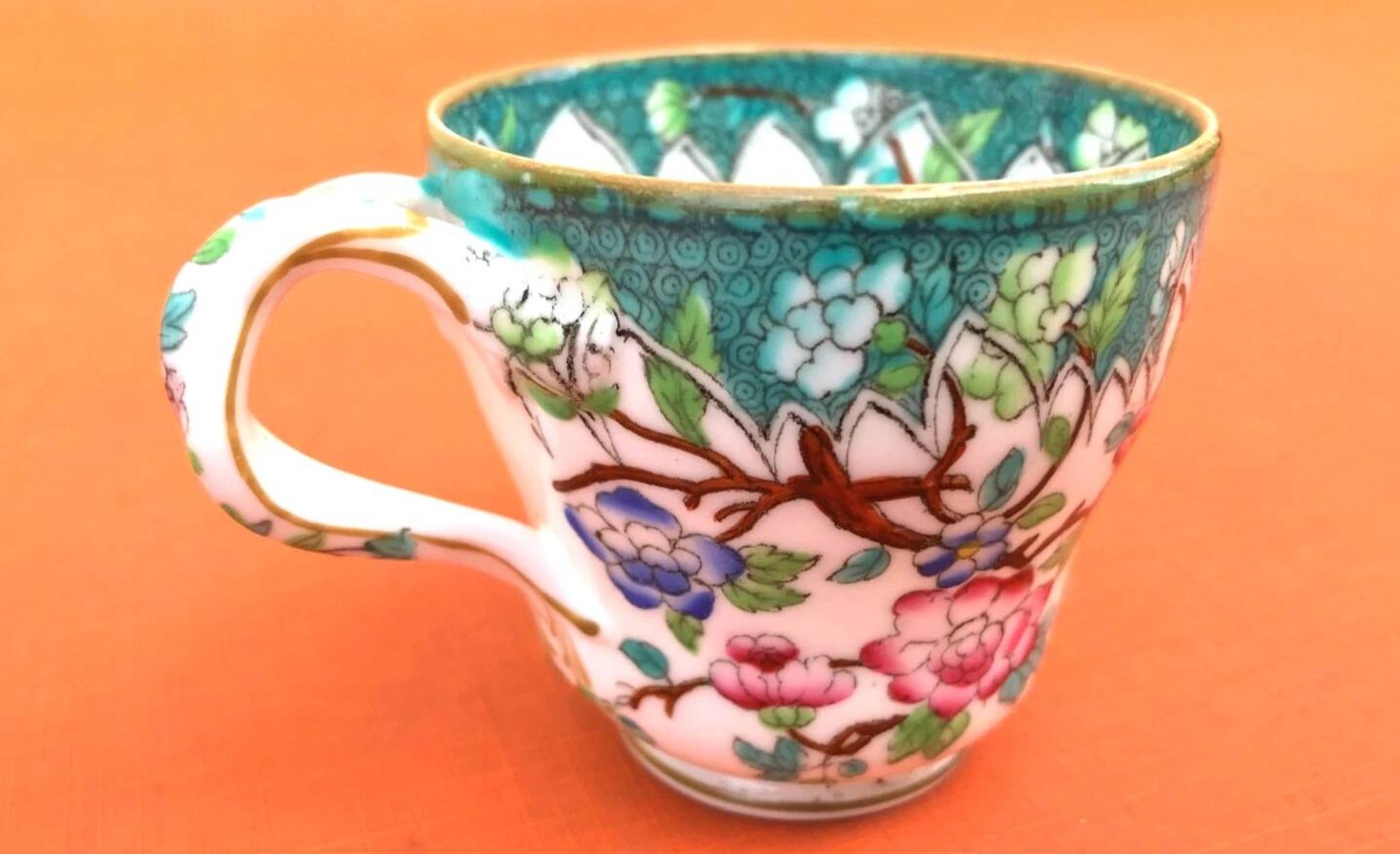Antique porcelain cup in the Minton style with Japanese decoration.