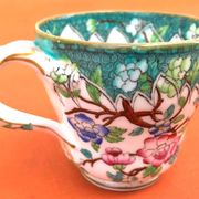 Antique porcelain cup in the Minton style with Japanese decoration.