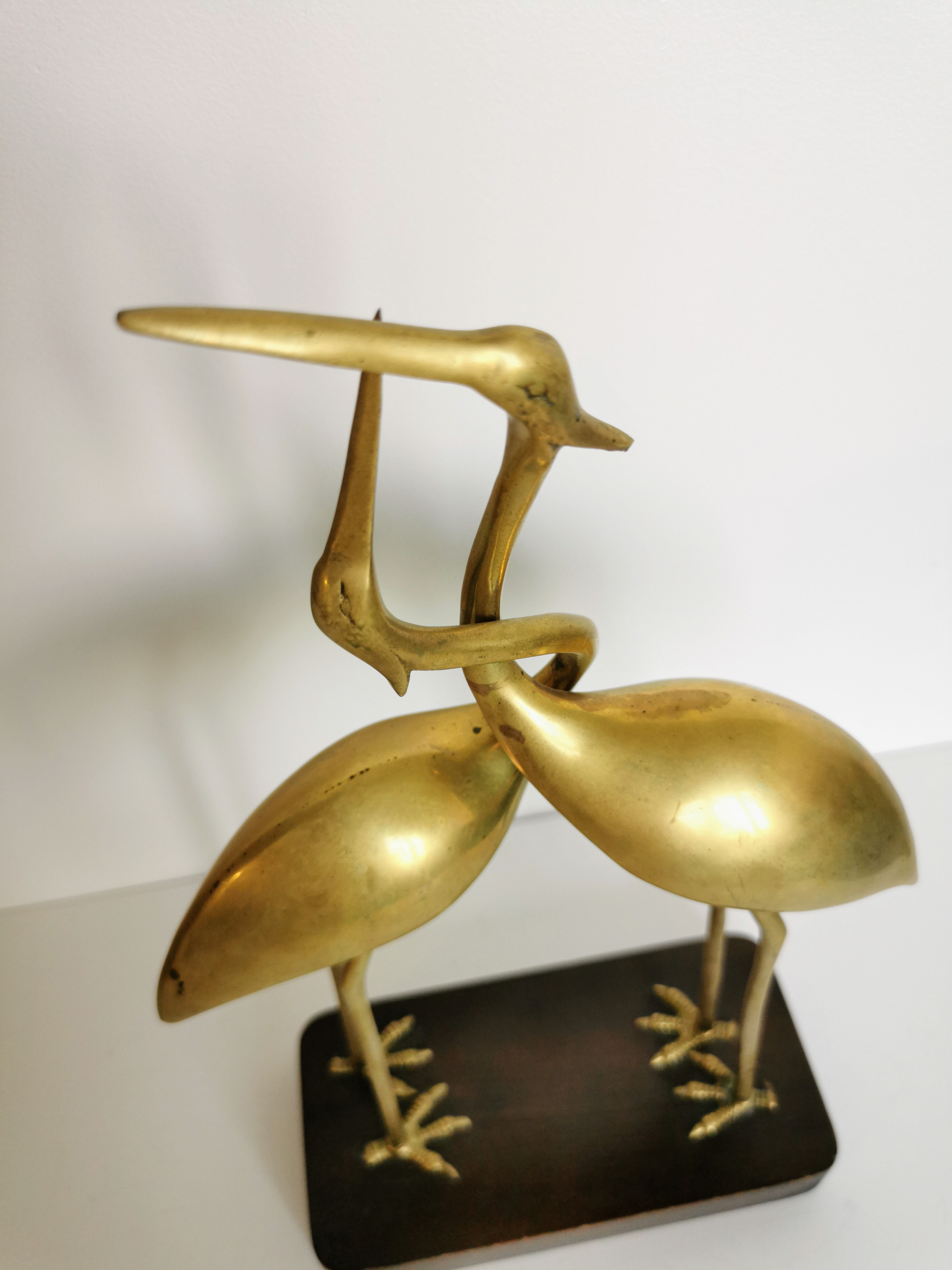 Couple of brass herons