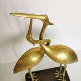 Couple of brass herons
