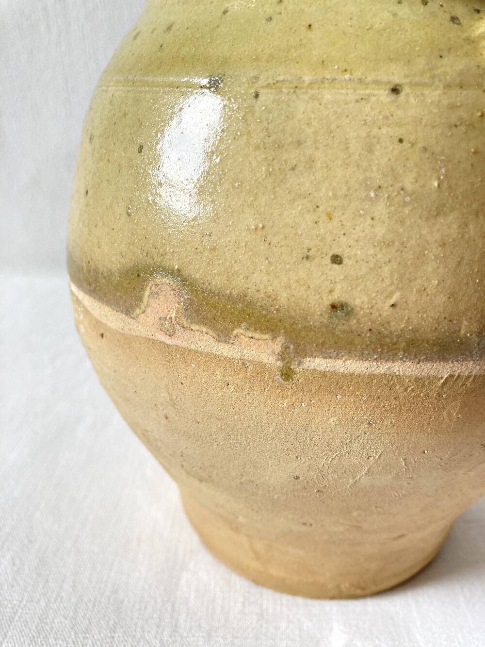 Old small goat-shaped jug in ochre glazed stoneware.
