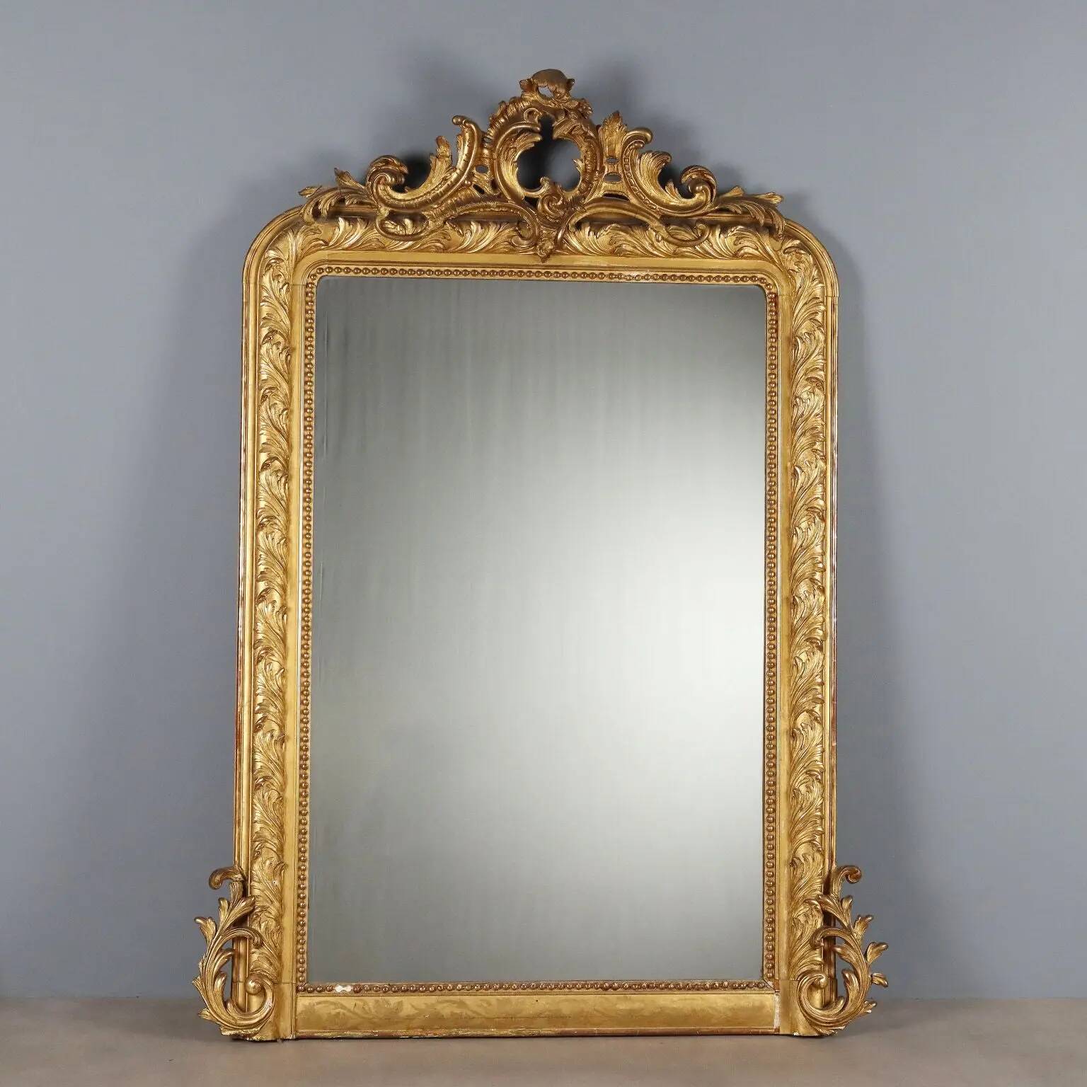 Antique eclectic style mirror in carved and gilded fir, Italy, 19th century.