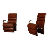 Pair of sculptural cognac leather armchairs, 1970s