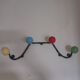 Vintage wall coat rack "Atomic" in wrought iron with multicoloured balls.