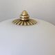 Pair of antique half-spherical ceiling sconces in white glass and brass.