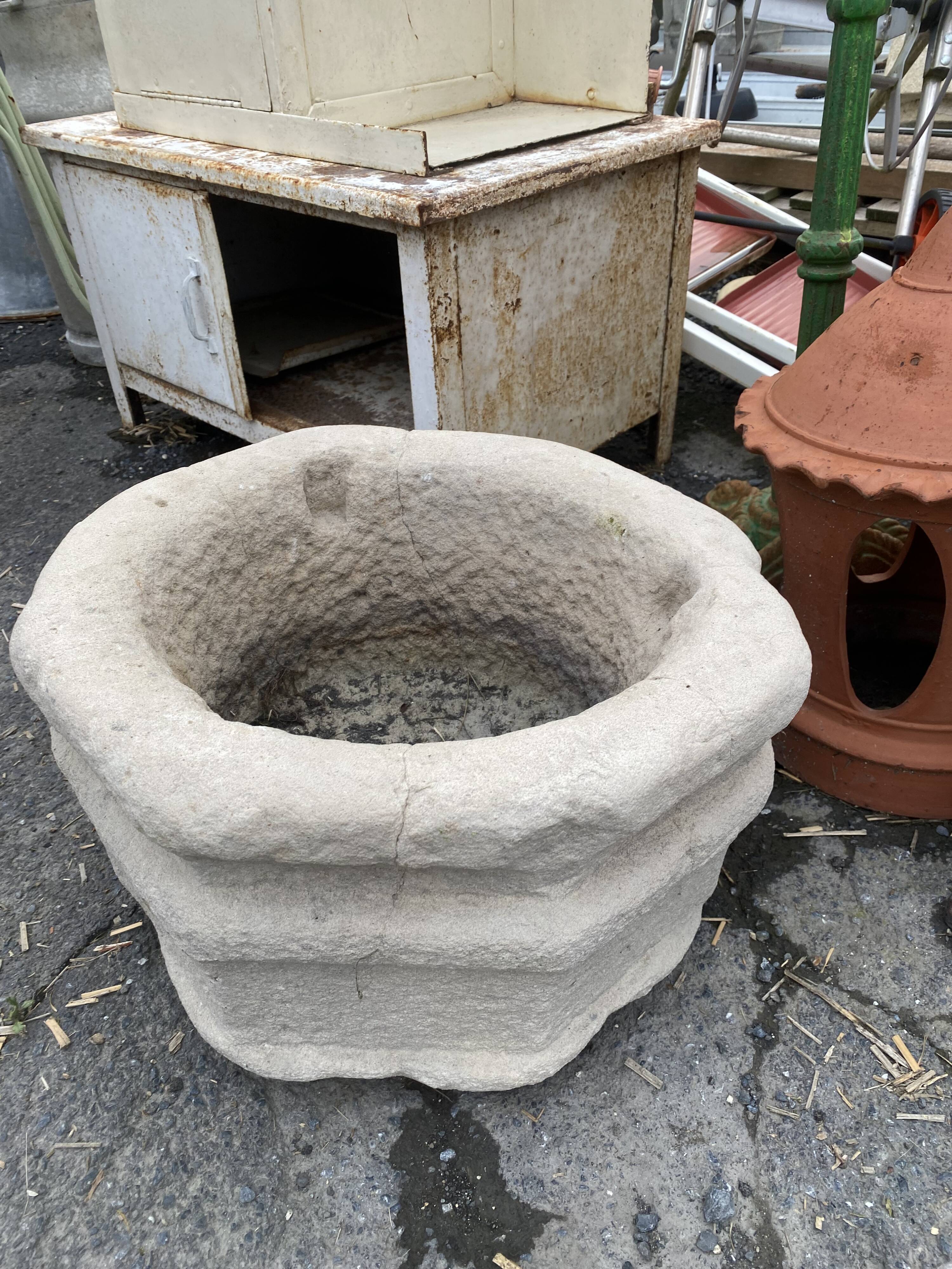 Ancient stone holy water font