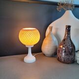 60's table lamp with tulip base and stretched wire shade.