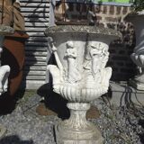 Medical vases with characters in reconstituted stone.