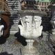 Medical vases with characters in reconstituted stone.