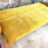 Convertible sofa in golden yellow velvet